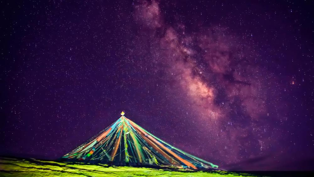Prayer flags pile with the Milky Way wallpaper
