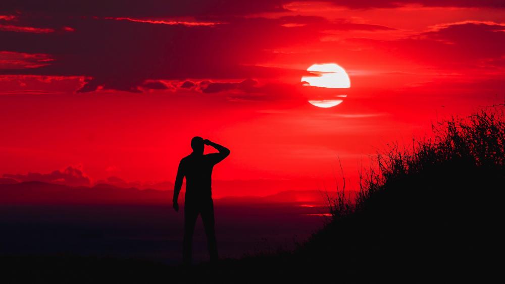 Man silhouette in the ablaze sunset wallpaper