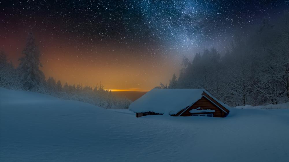 Snowy log cabin under the Milky Way wallpaper