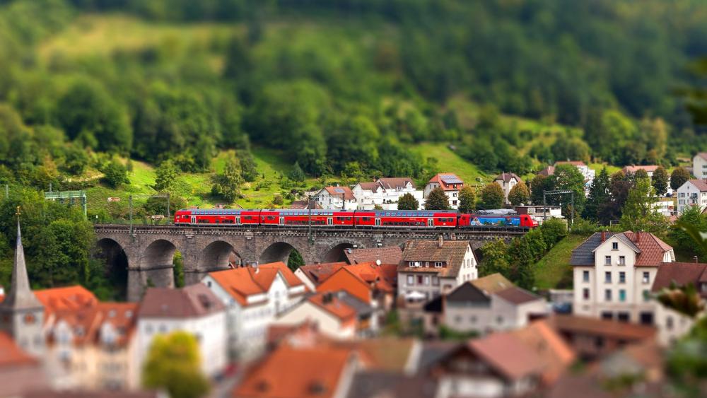 The train passed through the town - Tilt-shift photography wallpaper