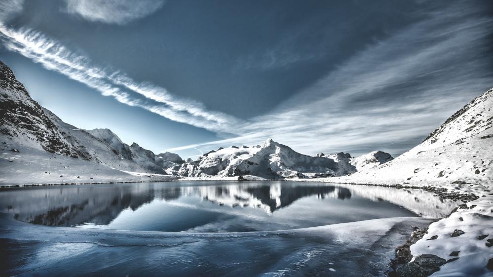 Snow capped mountains over the lake wallpaper