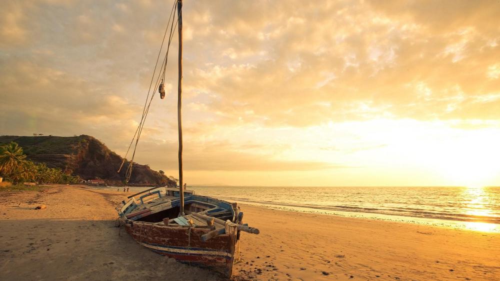 Abandoned sailboat in the sand wallpaper