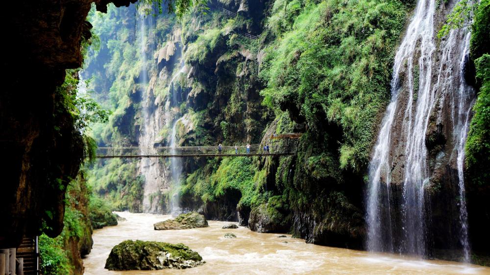 Bridge Over Majestic Canyon Waterfall wallpaper