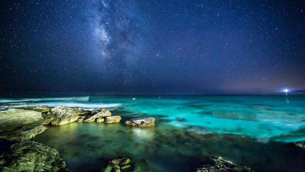 Starry night sky over the sea wallpaper