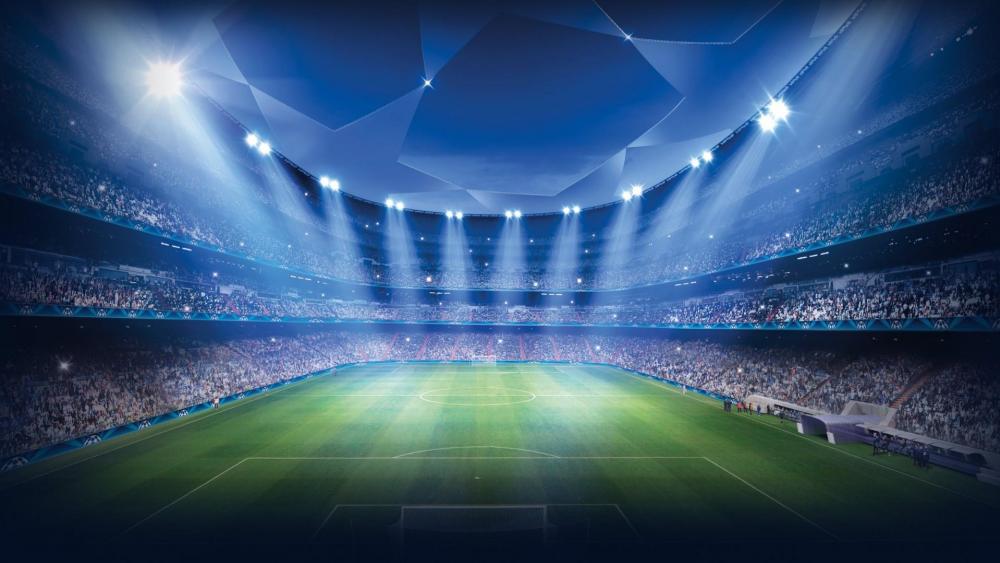 Illuminated Football Stadium Under Starry Night wallpaper
