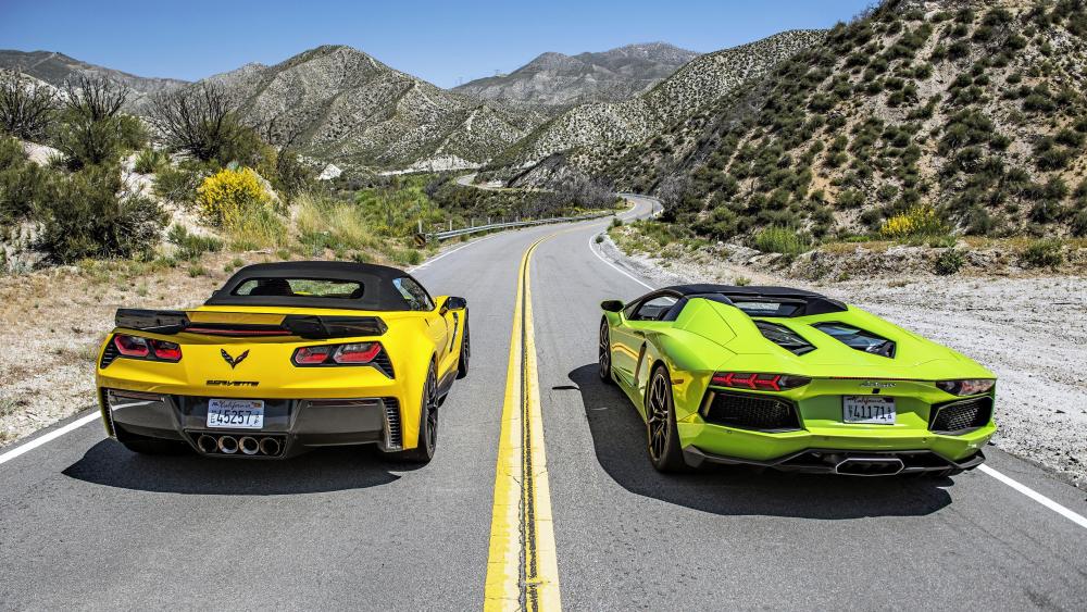Green Lamborghini Aventador roadster VS yellow Chevrolet Corvette wallpaper