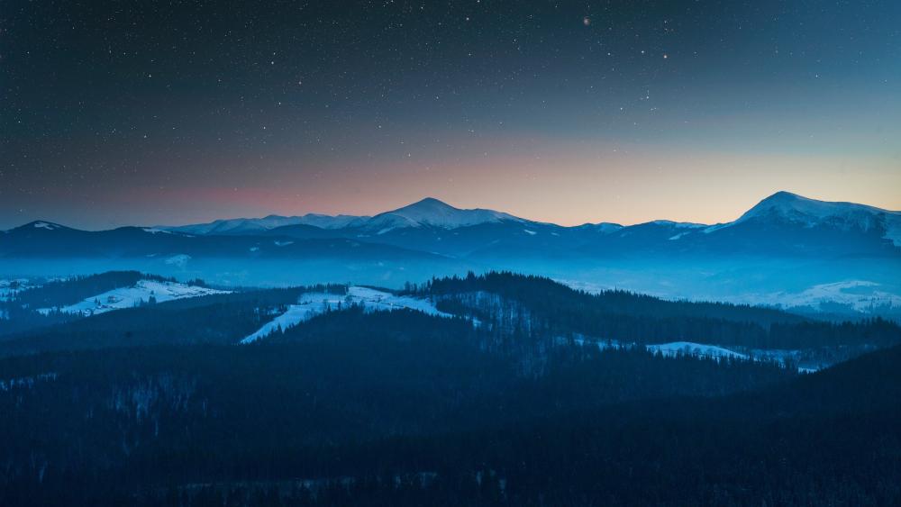 Enchanted Night Over Misty Mountains wallpaper