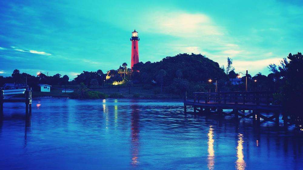 Red lighthouse next to the water wallpaper