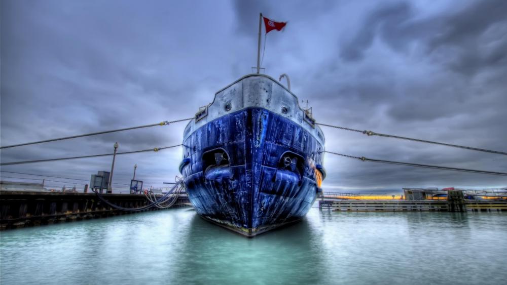 Blue ship in the harbour wallpaper