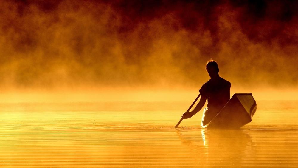 Rowing man on a lake wallpaper
