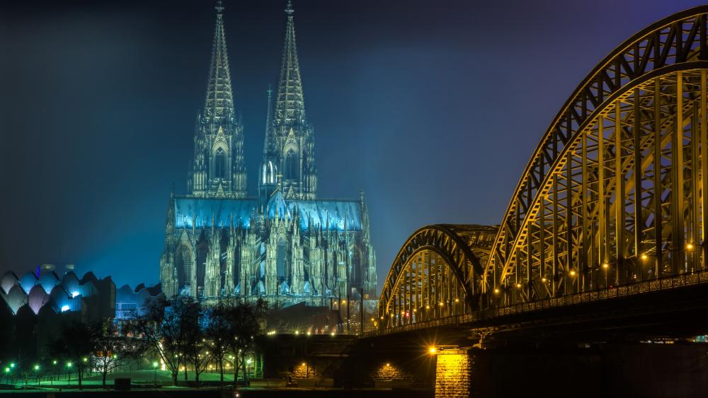 The Hohenzollern Bridge and the Cologne Cathedral at night wallpaper