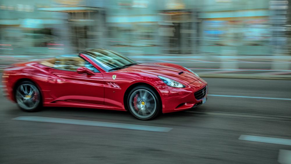 Speeding red Ferrari wallpaper