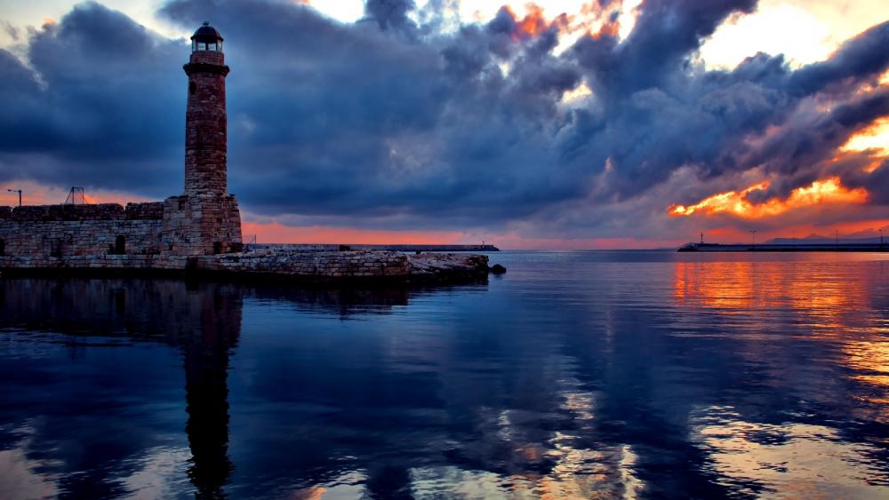 Lighthouse under the colorful clouds wallpaper