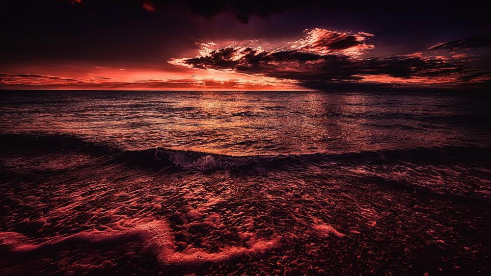 Red sky above the ocean wallpaper