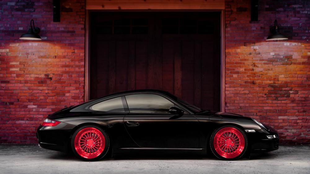 Black Porsche with red rims wallpaper