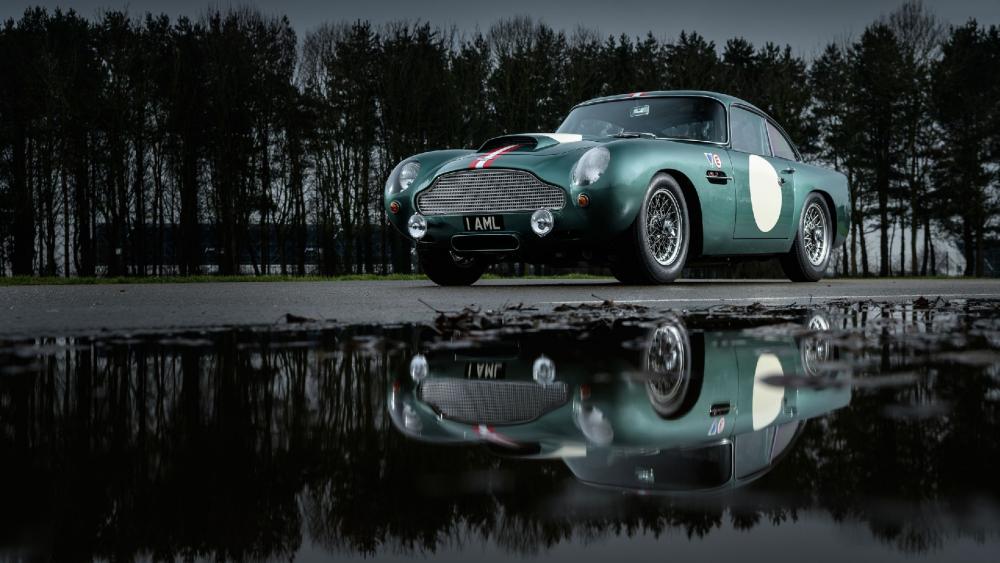 Aston Martin DB4 GT reflected in a puddle wallpaper