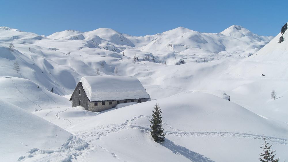 Snowy house in the mountains wallpaper