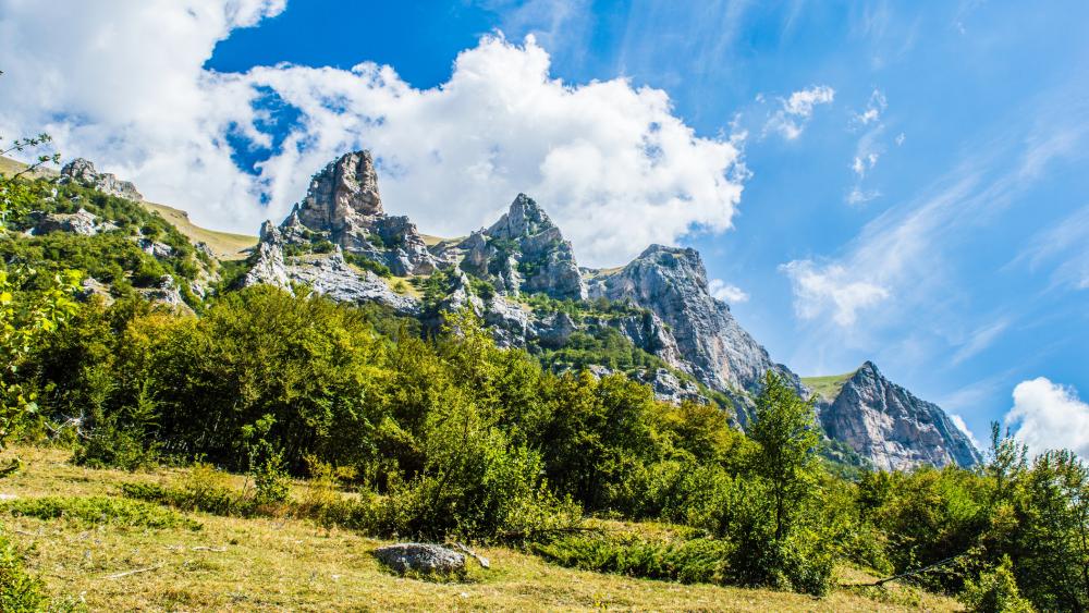 Clouds above the mountains wallpaper