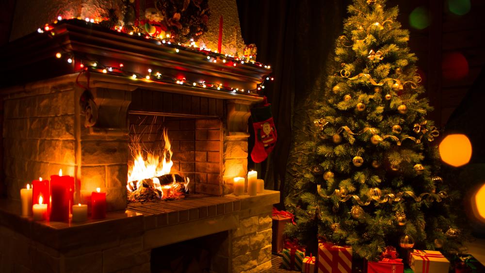Candle light in the fireplace at Christmas wallpaper