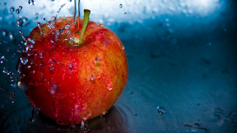 Waterdrops on an apple wallpaper