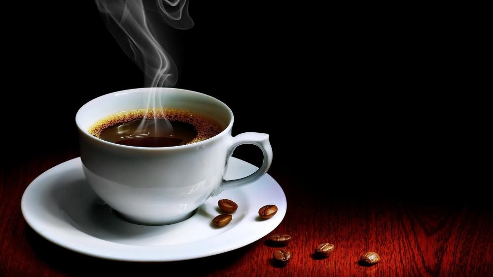 Hot steaming cup of coffee wallpaper
