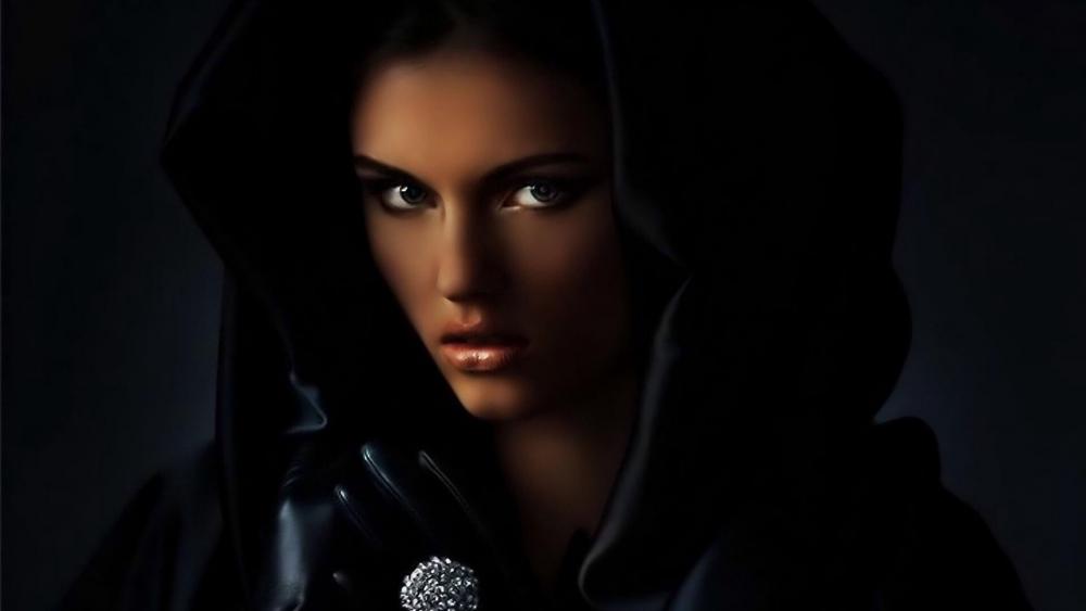 Girl in hooded black cloak wallpaper