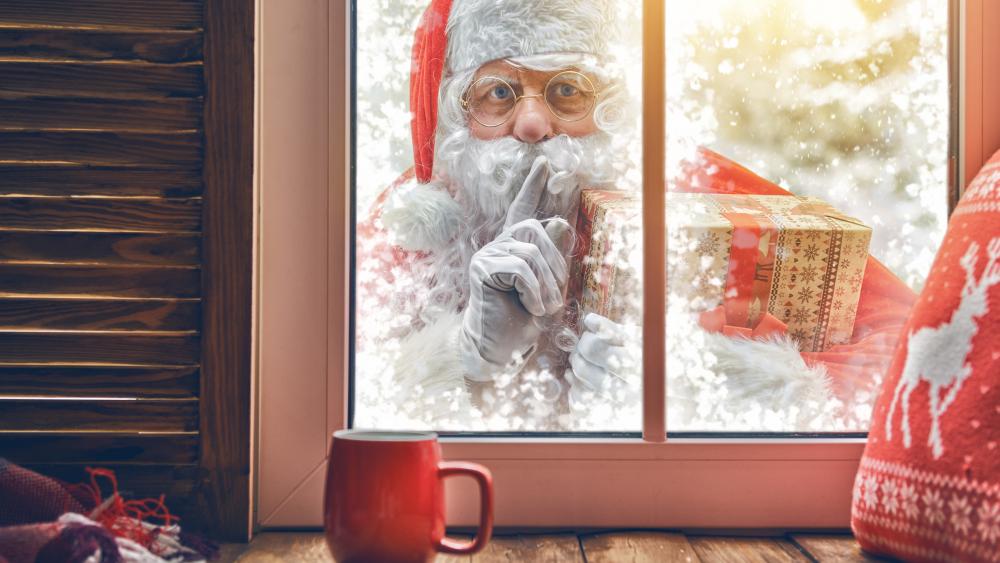 Santa Claus in front of the window wallpaper