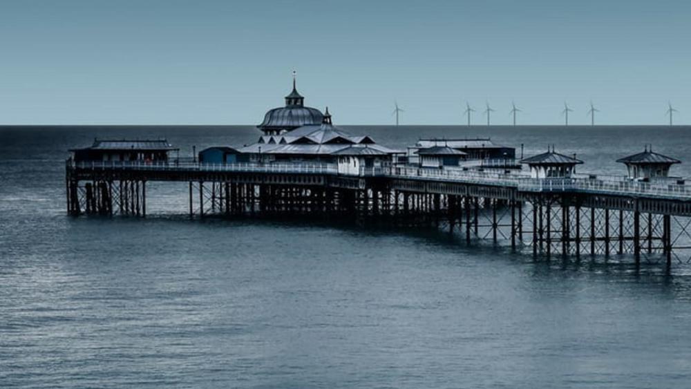 Llandudno Pier and windmills in the distance wallpaper