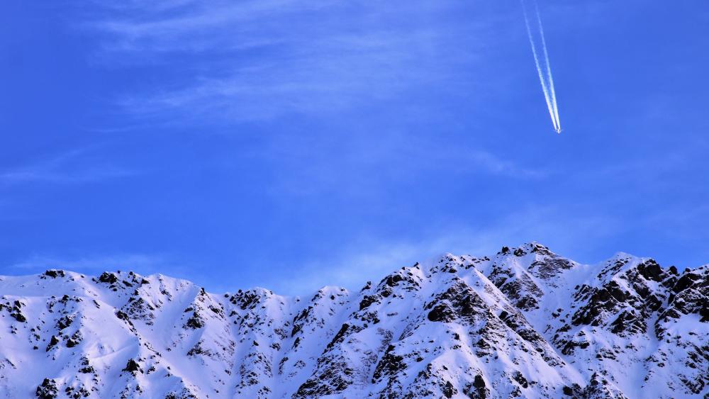 Contrails above the mountains wallpaper