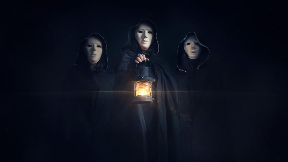 Masked hooded people with lantern wallpaper