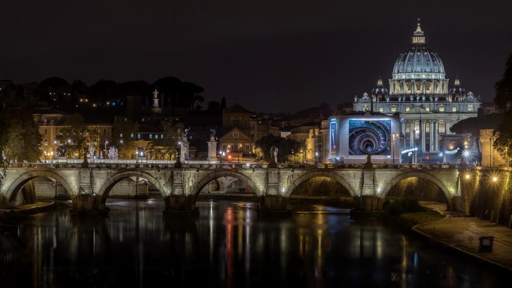 The St. Peter's Basilica and the Bridge Of Angels at night wallpaper