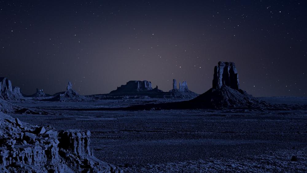 Buttes under the starry night sky wallpaper