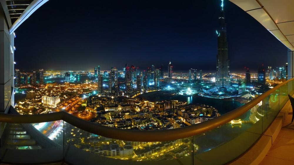 Balcony view of Dubai at night wallpaper