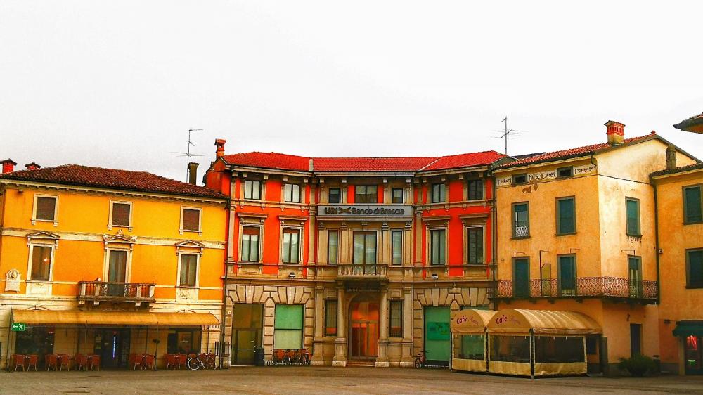 Charming City Square Under Soft Skies wallpaper