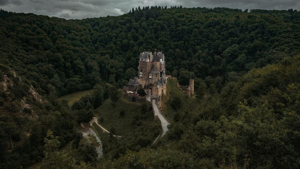 Eltz castle in the green forest wallpaper
