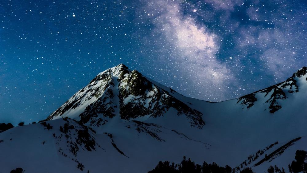 Stars over the snowy mountains wallpaper