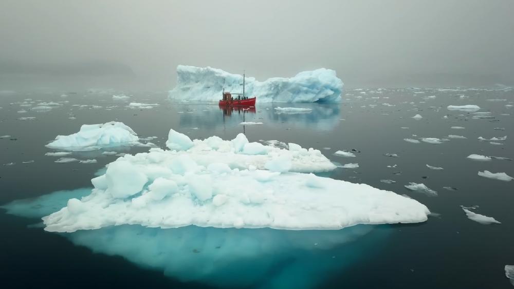 Red fishing boat in front of an iceberg wallpaper