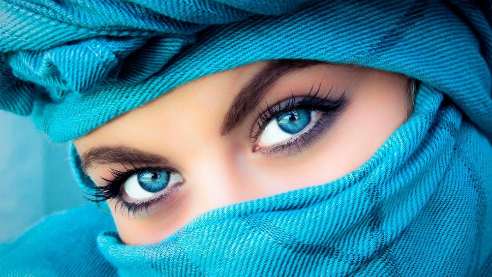 Blue-eyed woman in a blue headscarf wallpaper