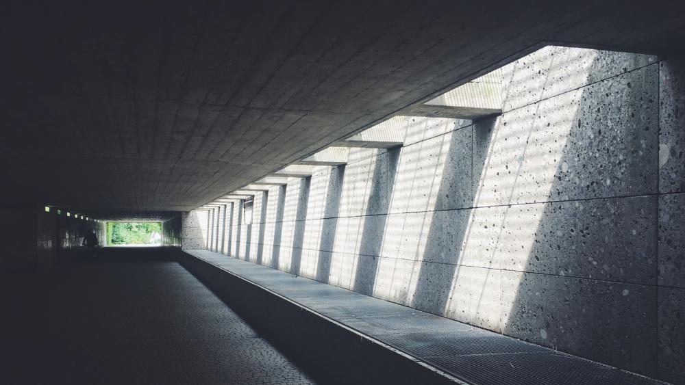 Concrete tunnel with sunrays wallpaper
