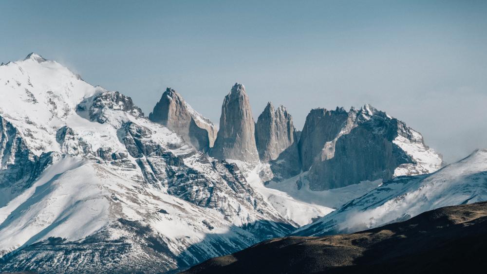 Majestic Mountain Peaks in Winter Silence wallpaper