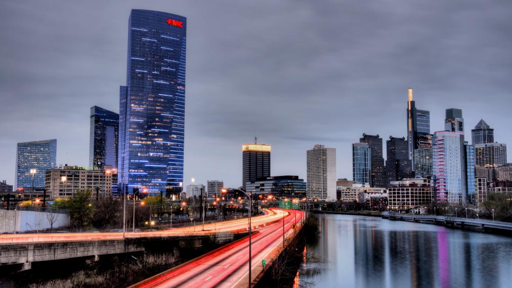 Urban Nightscape with City Lights and Reflections in the Water wallpaper
