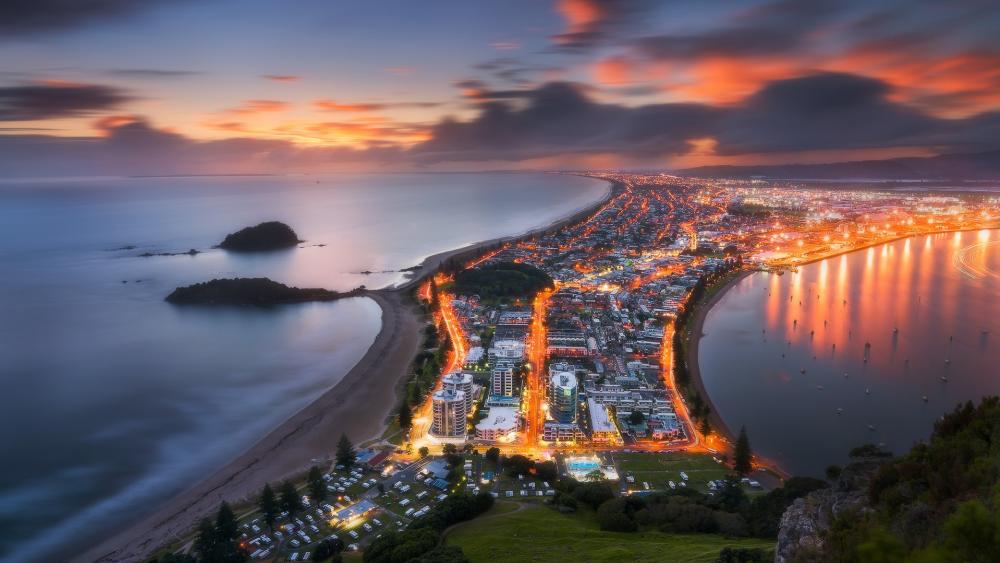 Stunning Aerial View of Coastal Cityscape at Twilight wallpaper