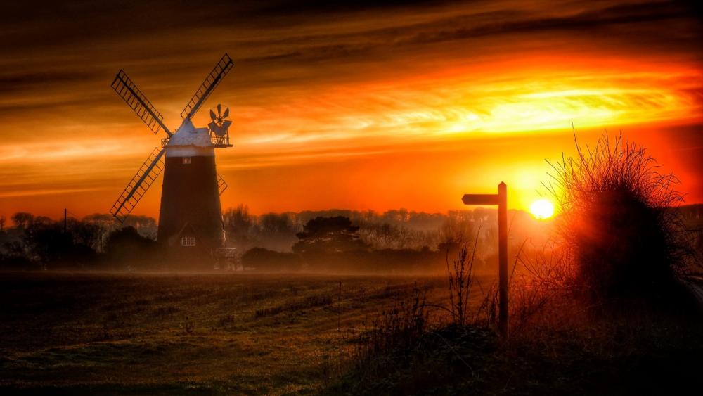 Sunset Serenity Over Windmill Horizon wallpaper