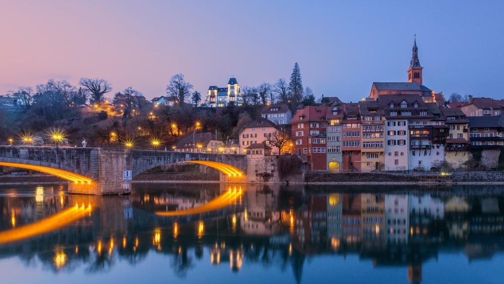 Charming Riverside Cityscape at Dusk wallpaper