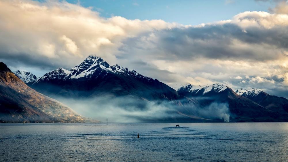 Majestic Mountain Serenity in Misty Waters wallpaper