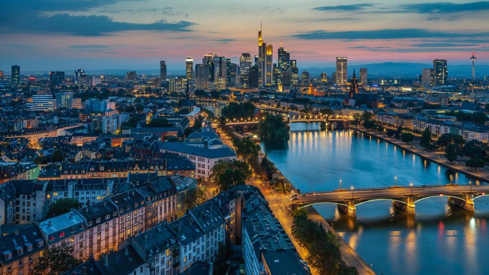 Cityscape at Dusk with River View wallpaper