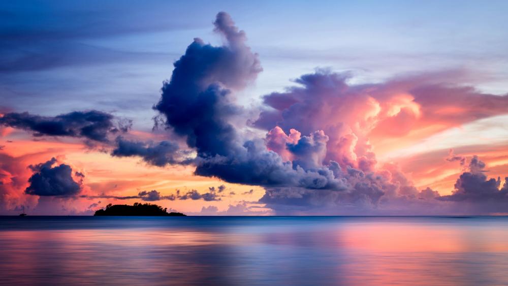 Surreal Sunset Skies Over Tranquil Waters wallpaper