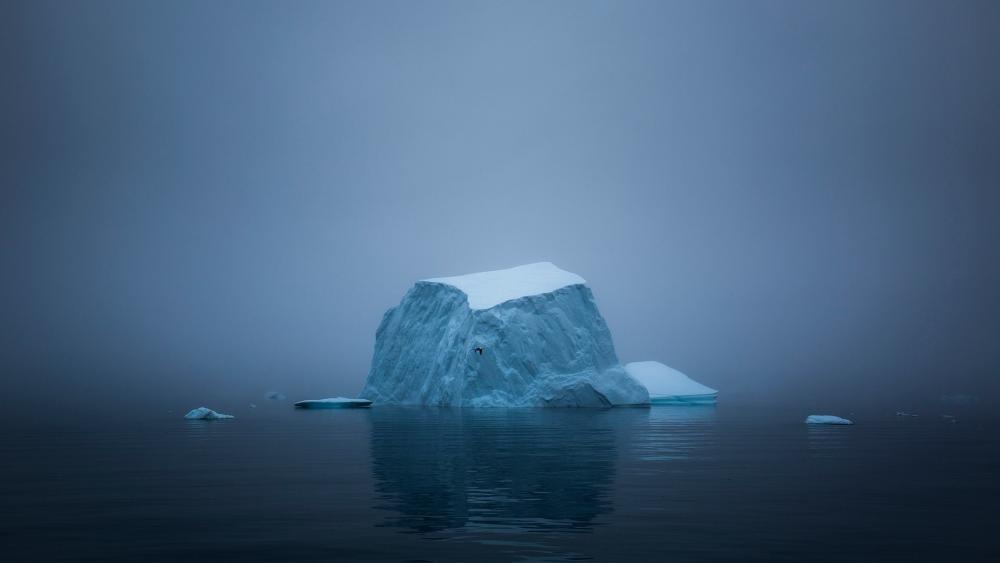 Majestic Iceberg in Misty Waters wallpaper