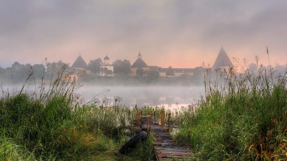 Serene Morning Mist Over Tranquil Waters wallpaper