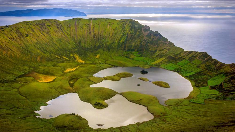 Majestic Crater Lake in Lush Greenery wallpaper
